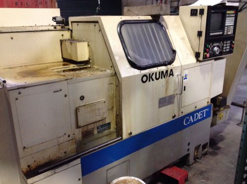 Okuma Cadet LNC8 CNC Lathe Chip Feeder And Bar Feeder