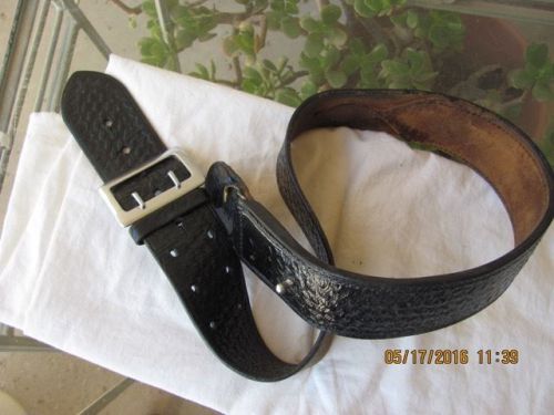 BLACK BASKET WEVE DESIGN BELT MARKED SAFTY SPEED  GOOD CONDITION  SIZE 34