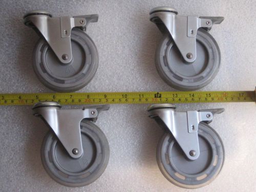 Set of four f.w. 4 inch casters with brake for sale