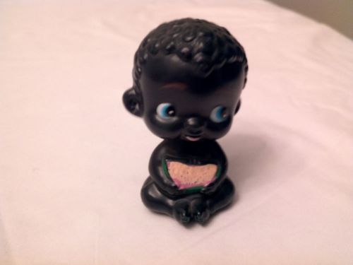 Black memorabilia. little black child bobble head. plastic 3 1/2 in. tall for sale