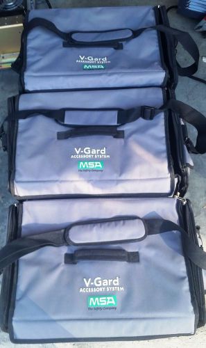 Lot of 3, msa v-guard accessory system case w/ hardhats, shields, fabric gear, + for sale