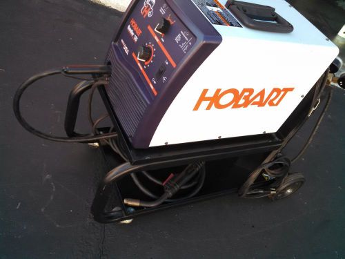 Hobart handler 135 mig and flux core welder with new helmet 500414 for sale