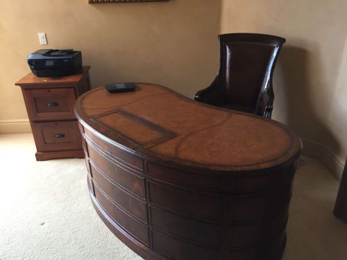 Brown Kidney bean shaped desk.