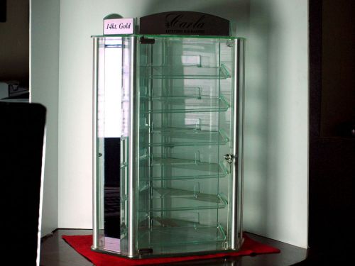 Spinning body jewelry display case with lock and key for sale